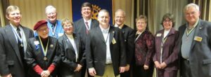 Left to right: Randy Becht, Dr. Virgie Cole-Mahan, Wayne Strohschein, Jackie Howard, DG Mark Pearce, Brad Budolfson, Dick Mazanec, Fran Mazanec, Marsha Hughes, and Ron Selfors.